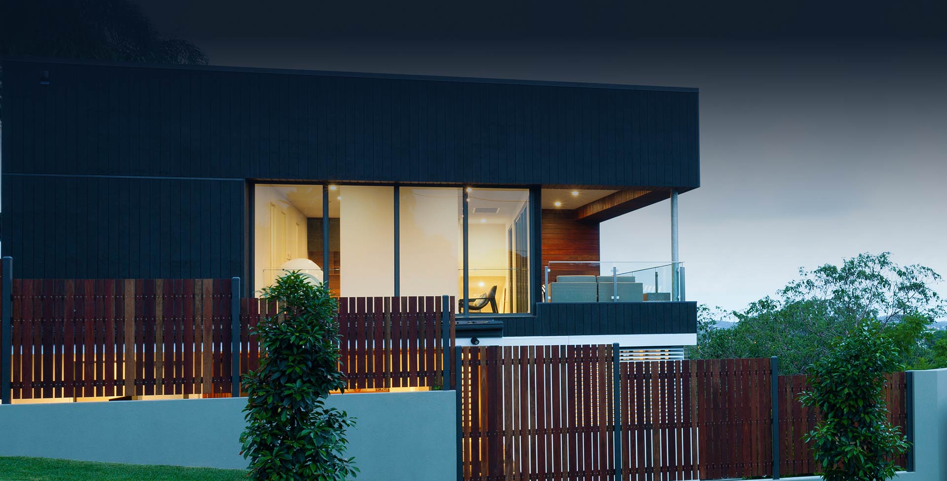New stylish modern home exterior at dusk